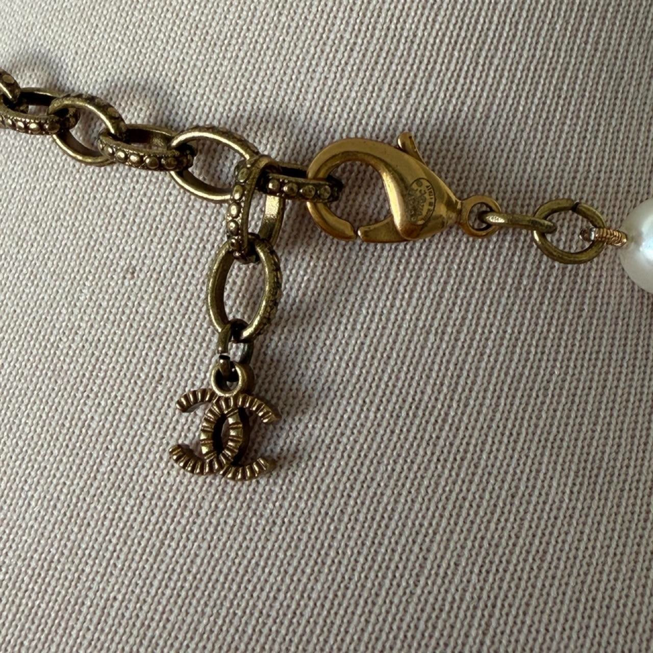 Chanel white pearl necklace with gold hardware and crystal accents