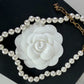 Chanel white pearl necklace with gold hardware and crystal accents