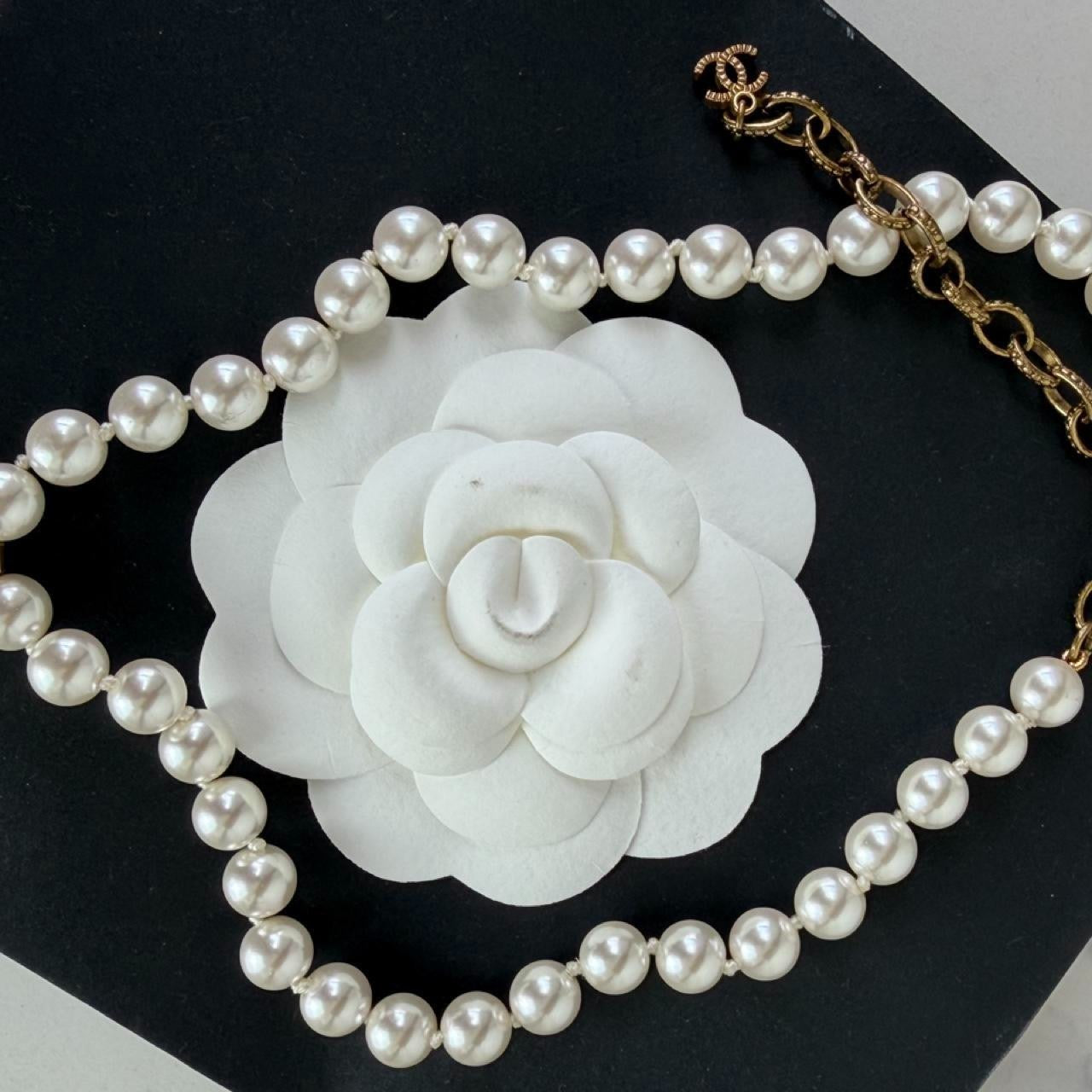 Chanel white pearl necklace with gold hardware and crystal accents