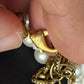 Chanel white pearl necklace with gold hardware and crystal accents