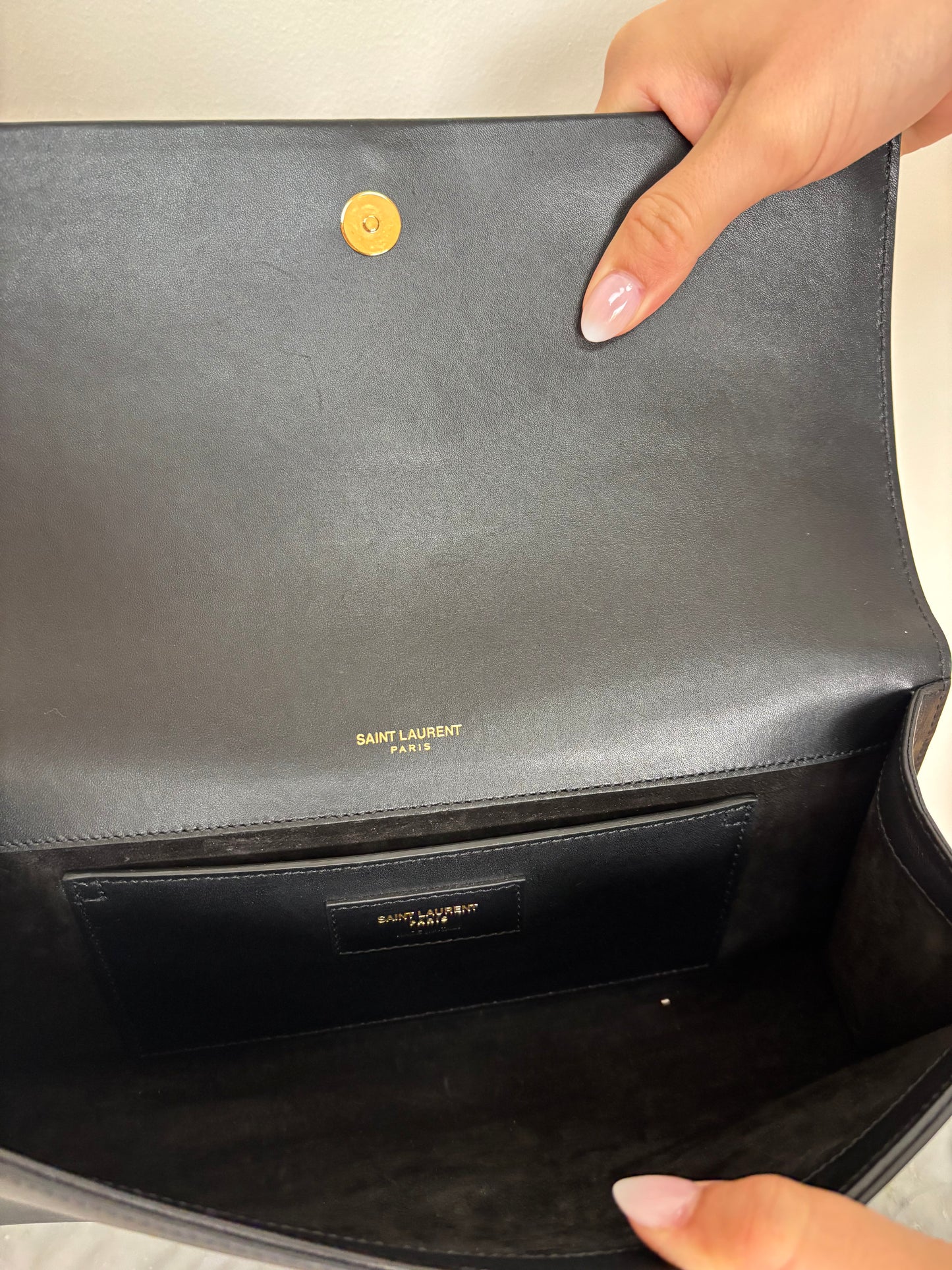 Black YSL Monogram Kate Tassel Clutch Bag with gold tassel
