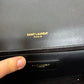 Black YSL Monogram Kate Tassel Clutch Bag with gold tassel