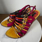 Louis Vuitton multicolored sandals with gold buckles and straps in magenta, orange, and yellow #luxury #designer